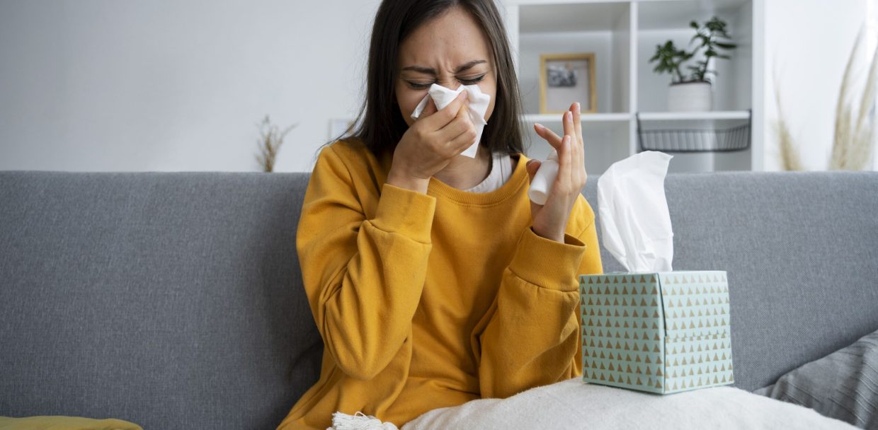 front-view-woman-blowing-nose-1